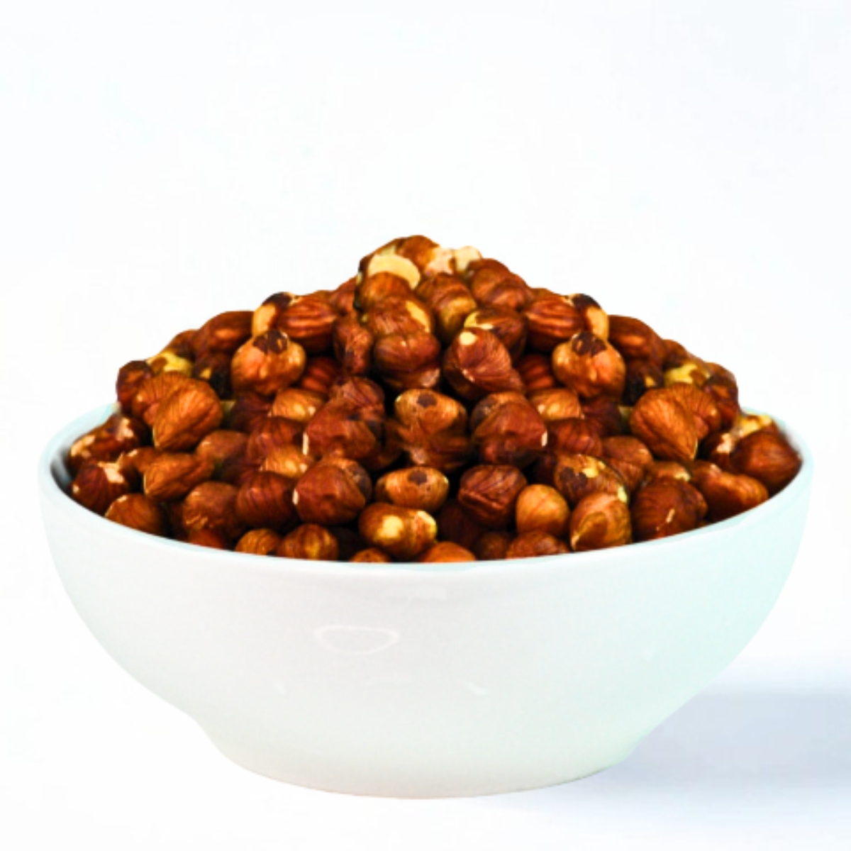 What is a historical use of hazelnuts in relation to chocolate?